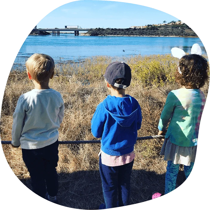adventure-scouts-coastal-explorers Children observing a North County San Diego coastal lagoon during an outdoor nature and STEM learning activity with Nature Scouts Collective.